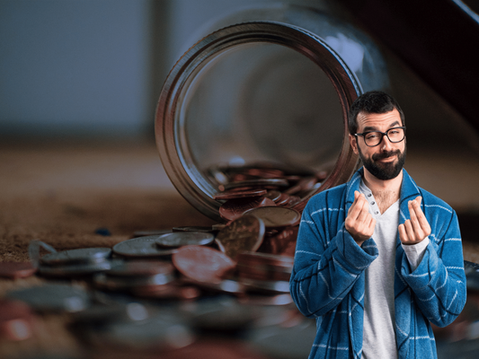 man rubbing fingers together in a dressing gown with money behind him