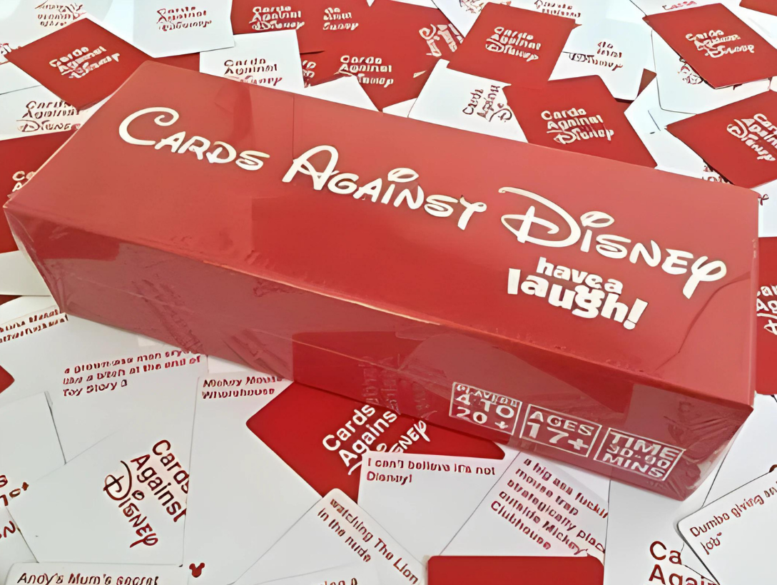 Cards Against Disney Box with cards behind it